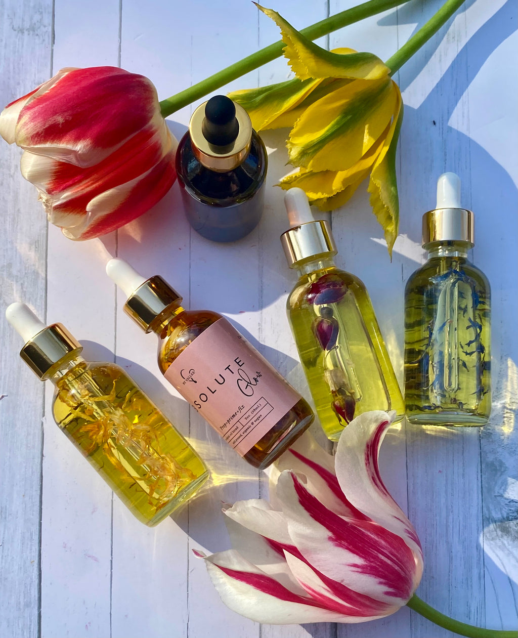 colorful flowers displayed with facial oils